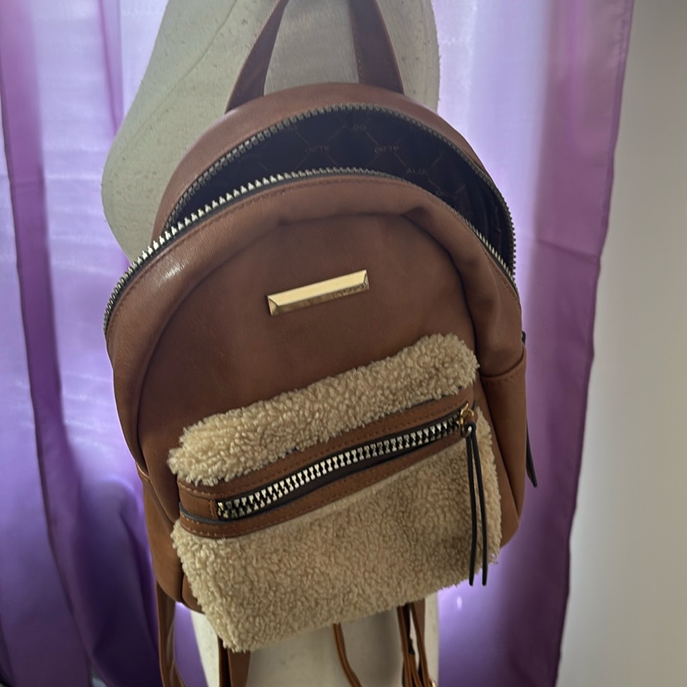 Brown leather and faux fur backpack